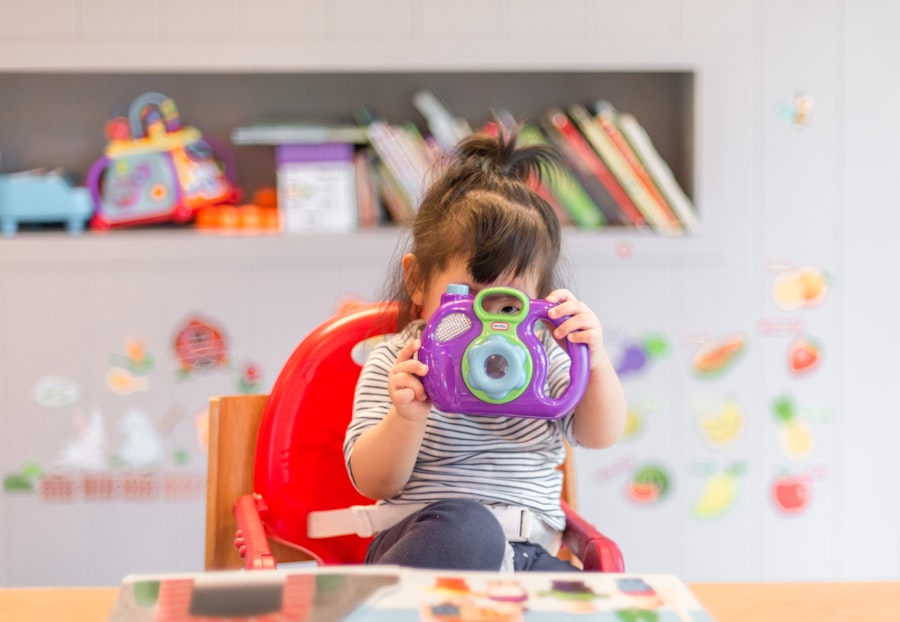 A young girl playing happily with a colorful toy.