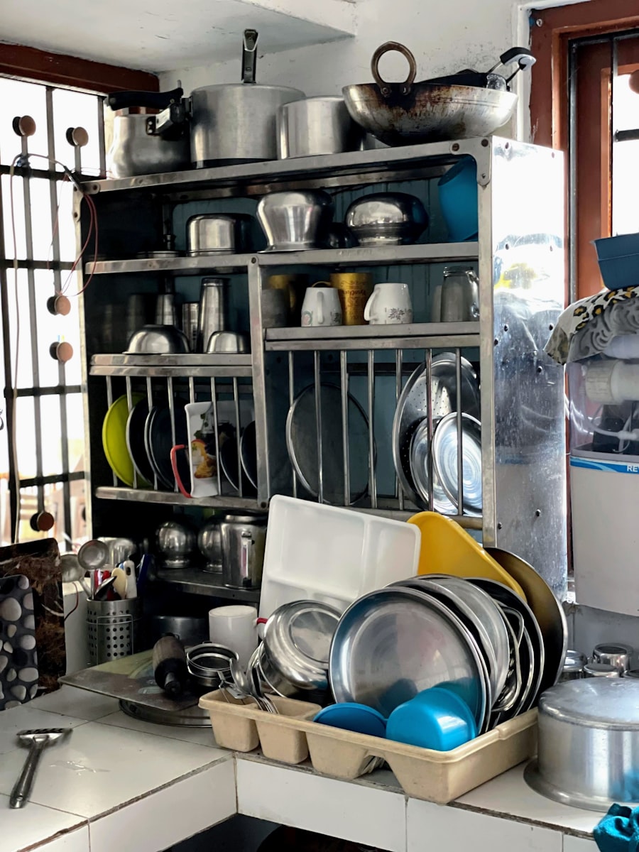 A kitchen with shelves of pots and cooking supplies.