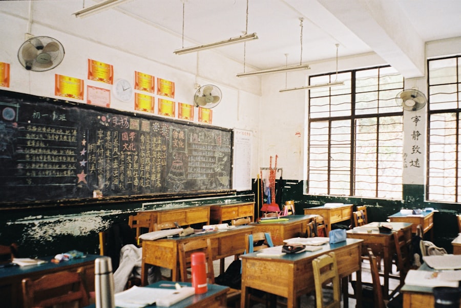 A rustic classroom with desks facing a chalkboard.
