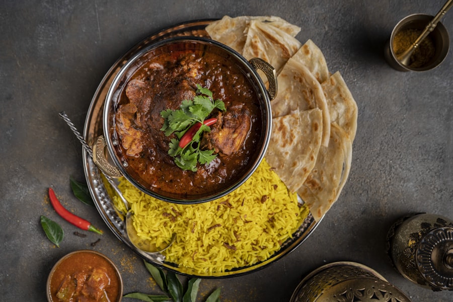 A warm, richly plated Indian thali meal.