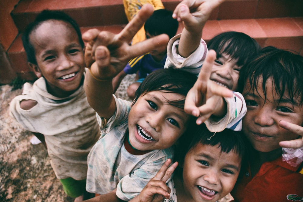 A group of joyful children laughing together outdoors.